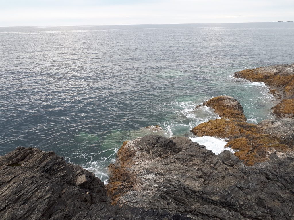 a picture of the rocky outcrops where people fish from in Ty Croes