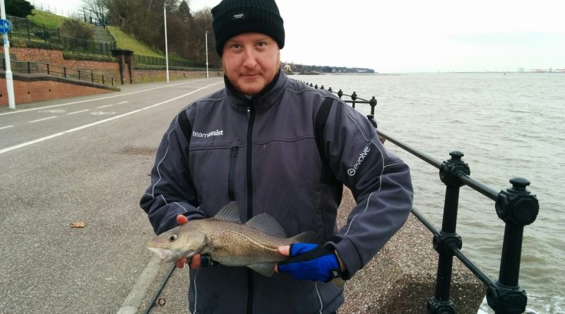 Myself holding a Cod I just caught at the Town Hall Steps fishing mark