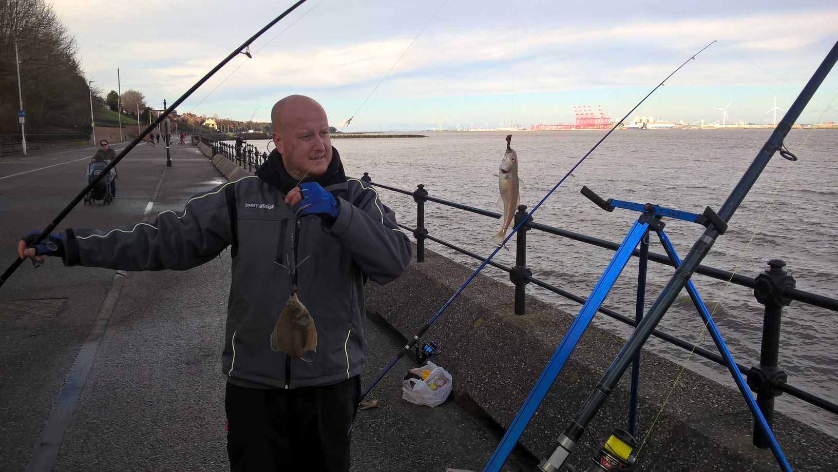 A picture of myself with two fish I just caught from the river mersey
