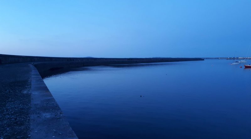 a picture of the breakwater at dusk